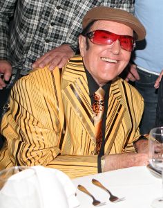 27-04-2010 SHOWBIZZ; EDDY WALLY IN FILM SAMEN MET SHARON STONE. Eduard Van de Walle of te wel Eddy Wally zal samen met Sharon Stone in een heuze Hollywood film komen te staan.Vorige week spraken wij met Eddy op de verjaardag van Johnny Hoes en hij vertelde het aan ieder die het wilde horen. Sharon Stone belt mij 3 x per week over de film die we gaan maken. De Basic Instinct actrice zou een van de tegenspelers worden van de Belg Eddy Wally. Het is bijna te mooi om waar te zijn. Volgens manager Hugo Colpaert zegt dat er wel degelijk afspraken zijn en dat Eddy een rol heeft in de komische film waarin Eddy de wereld moet gaan redden. Eddy Wally uit het Belgische Ertvelde is er klaar voor en kijkt uit naar de eerste ontmoeting met Sharon Stone.
foto: Albert den Iseger.